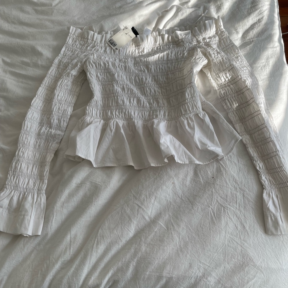 White ruffle off the shoulder top